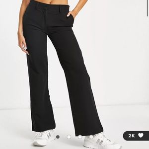 Cotton: On low rise wide leg trousers in black. NEW WITH TAGS